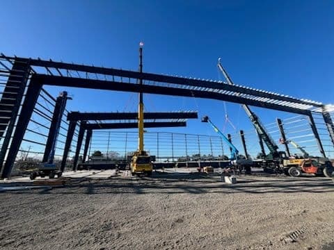 Structural component suspended during a commercial building install