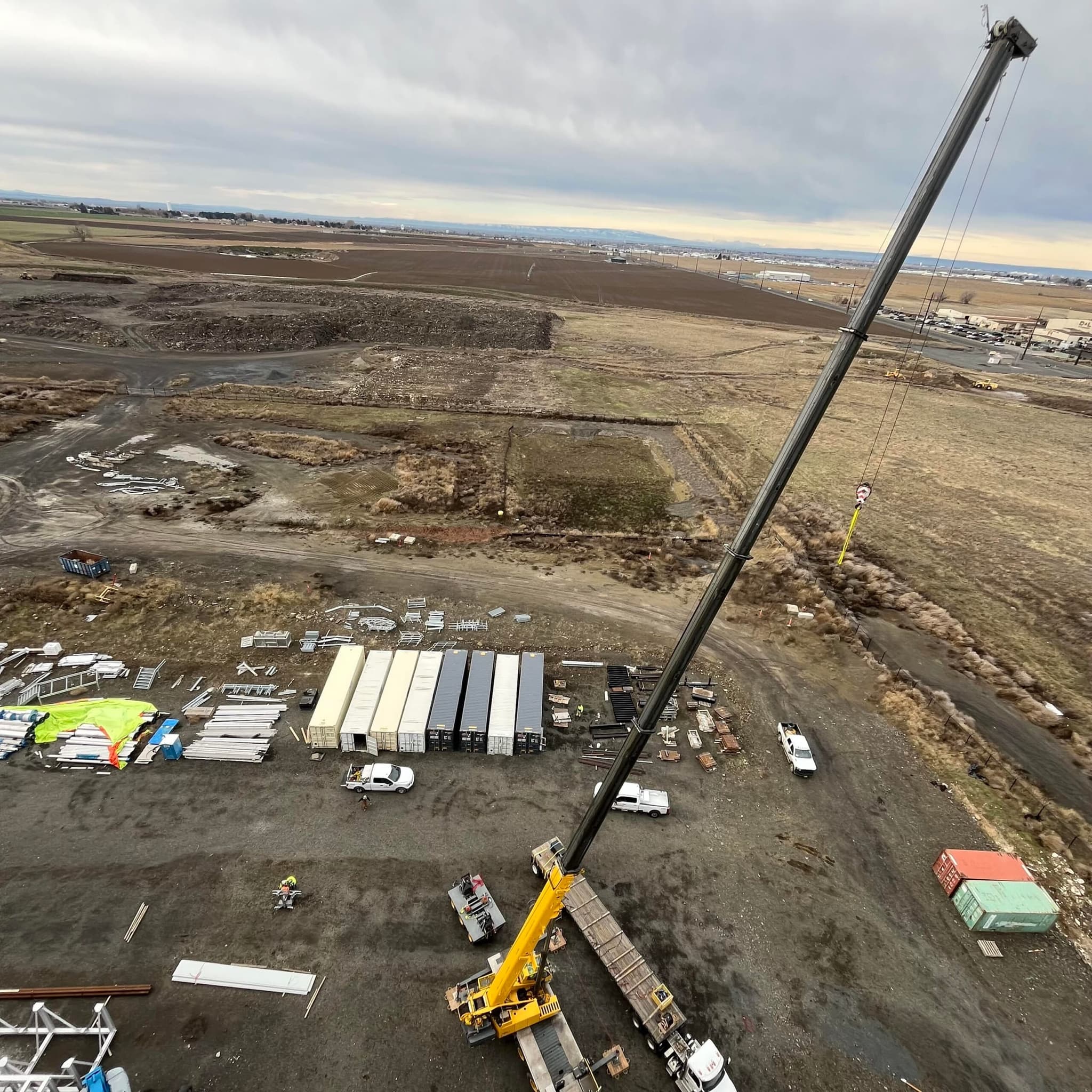 Crane and rigging setup on an agricultural processing facility site