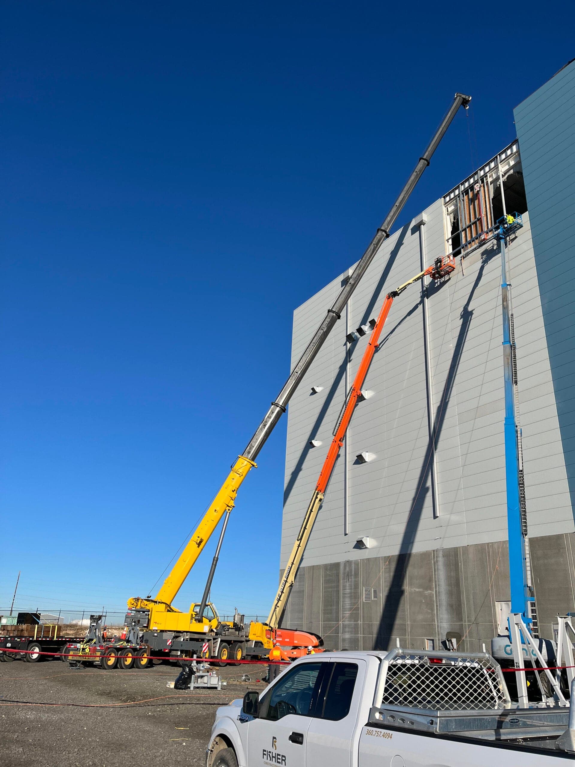 Equipment and materials staged at a Central Washington Crane & Rigging lay-down yard
